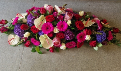 vibrant casket spray
