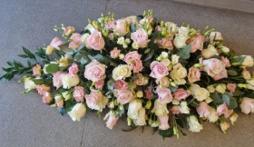 pink and white casket spray