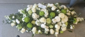 simplistic white and green casket spray